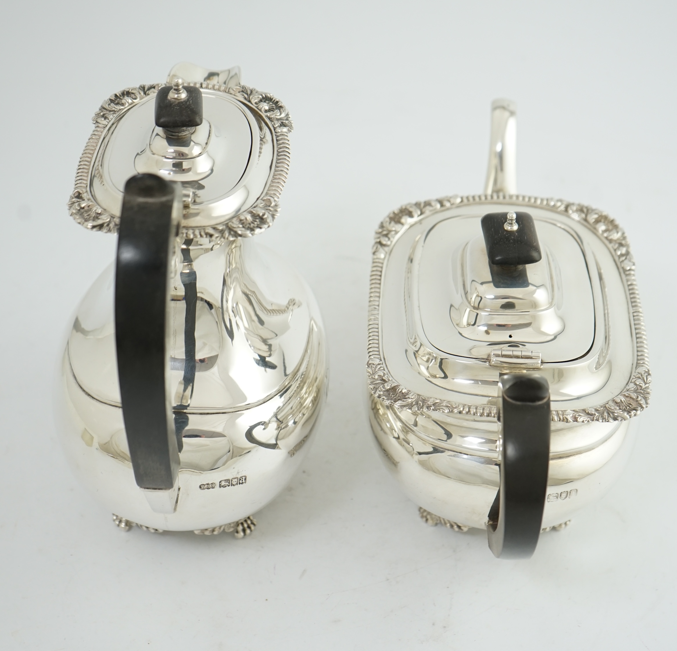 A George V silver hot water pot and matching teapot, by Reid & Sons